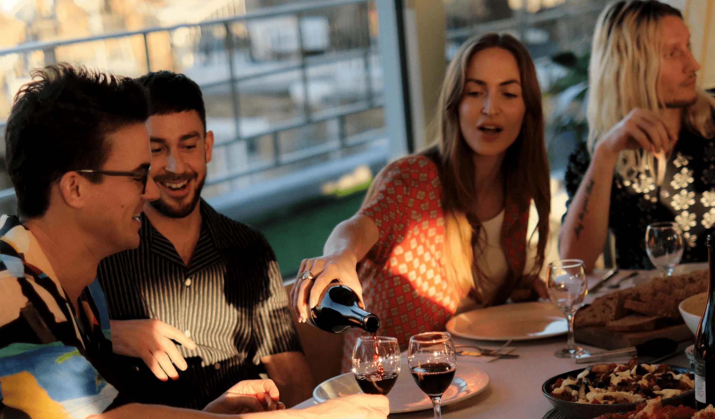 Hands arranging place cards, symbolizing curation